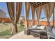 Relaxing outdoor space featuring a pergola with privacy curtains and an outdoor seating area at 77 N Jackson Gap Way, Aurora, CO 80018