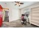 Bedroom featuring a desk, shelving unit and closet with a red door at 77 N Jackson Gap Way, Aurora, CO 80018