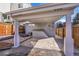 Covered patio with concrete floor and wood fencing at 1267 Quitman St, Denver, CO 80204