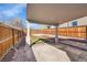 Yard featuring concrete patio, artificial turf, and wood fencing at 1267 Quitman St, Denver, CO 80204