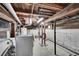 Unfinished basement with exposed ceiling, concrete walls, and mechanical systems at 1267 Quitman St, Denver, CO 80204