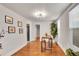 Bright dining area with wood floors, modern lighting, and artwork on the walls at 1267 Quitman St, Denver, CO 80204