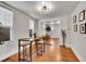 Bright dining area leading into a living area, featuring wood floors and natural light at 1267 Quitman St, Denver, CO 80204