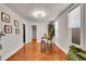 Bright dining area with wood floors, modern lighting, and a cozy breakfast table at 1267 Quitman St, Denver, CO 80204