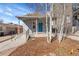 Charming home exterior with a welcoming front porch and vibrant blue door at 1267 Quitman St, Denver, CO 80204