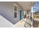 Welcoming covered front porch featuring a bright blue door and modern railings at 1267 Quitman St, Denver, CO 80204