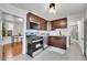 Cozy kitchen featuring stainless steel appliances, granite counters, and stylish cabinets at 1267 Quitman St, Denver, CO 80204