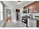 Cozy kitchen featuring stainless steel appliances, granite counters, and stylish cabinets at 1267 Quitman St, Denver, CO 80204