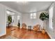 Bright living room area showing seating and hardwood flooring at 1267 Quitman St, Denver, CO 80204