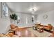 Cozy living room with hardwood floors, a comfortable couch, and ample natural light at 1267 Quitman St, Denver, CO 80204