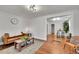 Comfortable living room featuring hardwood floors and a stylish brown leather couch at 1267 Quitman St, Denver, CO 80204