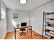 Bright home office with wood floors, natural light, and built-in shelving at 1267 Quitman St, Denver, CO 80204