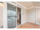 Balcony featuring a sliding glass door with access to storage and outdoor space at 9677 W Chatfield Ave # E, Littleton, CO 80128