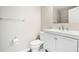 Clean bathroom featuring a vanity with storage, a toilet, and modern fixtures for comfort and style at 9677 W Chatfield Ave # E, Littleton, CO 80128