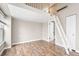Cozy bedroom featuring hardwood floors, a loft space, and ample storage in a tranquil setting at 9677 W Chatfield Ave # E, Littleton, CO 80128