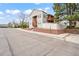 A lovely condo building showcases its two-story layout with a balcony, complemented by a brick foundation at 9677 W Chatfield Ave # E, Littleton, CO 80128