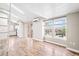 Living space with high ceilings and an adjacent kitchen at 9677 W Chatfield Ave # E, Littleton, CO 80128