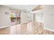 Bright living room with hardwood floors, loft area, and sliding doors to the balcony at 9677 W Chatfield Ave # E, Littleton, CO 80128