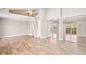 Spacious living room features hardwood floors, a loft, and sliding glass doors to a private balcony at 9677 W Chatfield Ave # E, Littleton, CO 80128