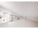 A lofted bedroom features a view of the kitchen below at 9677 W Chatfield Ave # E, Littleton, CO 80128