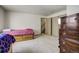 Bedroom features twin bed with built in storage, and a vintage wooden dresser at 19105 Eagle Ridge Dr, Golden, CO 80401