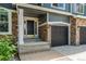 Inviting home entrance featuring a stylish front door, stone accents, and a well-lit porch at 19105 Eagle Ridge Dr, Golden, CO 80401