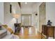 Welcoming home foyer featuring hardwood floors, a charming table, and views of the front door at 19105 Eagle Ridge Dr, Golden, CO 80401