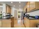 Bright kitchen features hardwood floors, stainless steel appliances and granite countertops at 19105 Eagle Ridge Dr, Golden, CO 80401