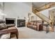 Comfortable living room featuring a fireplace, plush leather seating, and a cozy atmosphere at 19105 Eagle Ridge Dr, Golden, CO 80401