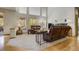 Bright and airy living room with large windows, plush seating, and hardwood flooring at 19105 Eagle Ridge Dr, Golden, CO 80401