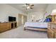 Large main bedroom features neutral carpet, ceiling fan and ample closet space at 19105 Eagle Ridge Dr, Golden, CO 80401