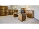 Spacious office featuring built-in bookshelves, large desk, and a comfortable office chair at 19105 Eagle Ridge Dr, Golden, CO 80401
