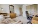 Spacious office with a comfortable sofa, sleek black desk chair, storage shelves, and plenty of room to work at 19105 Eagle Ridge Dr, Golden, CO 80401