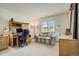 Bright home office with built-in desk, comfortable sofa, ample storage, and natural light from a window at 19105 Eagle Ridge Dr, Golden, CO 80401