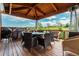Outdoor patio with a wooden pergola, dining furniture, and beautiful views at 19105 Eagle Ridge Dr, Golden, CO 80401