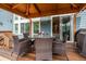 Covered patio with dining set, wood decking, and convenient access to the house at 19105 Eagle Ridge Dr, Golden, CO 80401