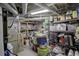 Unfinished basement with utilities, shelving, and ample storage space at 345 S Ogden St, Denver, CO 80209