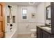 Modern bathroom with a soaking tub, subway tile surround, and updated fixtures at 345 S Ogden St, Denver, CO 80209