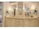 Elegant bathroom featuring a double vanity with marble countertops and decorative mirrors at 345 S Ogden St, Denver, CO 80209