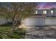 Charming townhouse with a tree swing, garage, and well-manicured front lawn at 5559 S Quemoy Cir, Aurora, CO 80015