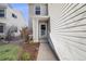 Home exterior featuring a walkway leading to the front door and landscaped garden at 5559 S Quemoy Cir, Aurora, CO 80015