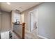 Upstairs hallway features neutral colors and carpet leading to bedrooms at 5559 S Quemoy Cir, Aurora, CO 80015