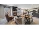 Inviting living room featuring a cozy fireplace, plush seating, and modern decor at 5559 S Quemoy Cir, Aurora, CO 80015