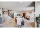 Relaxing living room with a staircase, plush seating, and contemporary accents at 5559 S Quemoy Cir, Aurora, CO 80015
