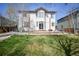 Well-maintained backyard features a grassy lawn, patio area, and plenty of space at 1386 Avgare Way, Erie, CO 80516