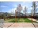 Spacious backyard with a well-manicured lawn and large stone patio at 1386 Avgare Way, Erie, CO 80516