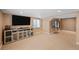 Finished basement with entertainment center, storage and a cozy space for relaxing or entertaining at 1386 Avgare Way, Erie, CO 80516