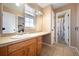 Well-lit bathroom boasts a large vanity with a makeup area and tile flooring at 1386 Avgare Way, Erie, CO 80516