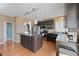 Well-equipped kitchen with stainless steel appliances and a center island at 1386 Avgare Way, Erie, CO 80516