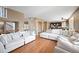 Open concept living area featuring hardwood floors and ample natural light at 1386 Avgare Way, Erie, CO 80516